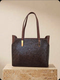 Two-tone chocolate brown hand-tooled leather tote bag with gold hardware, handmade in México